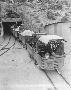 BOM18 - Baby Gauge Railraod Baby Gauge ore arriving from the widow Mine at Portal of Upper Biddy Tunnel - Courtesy National Park Service, Death Valley National Park